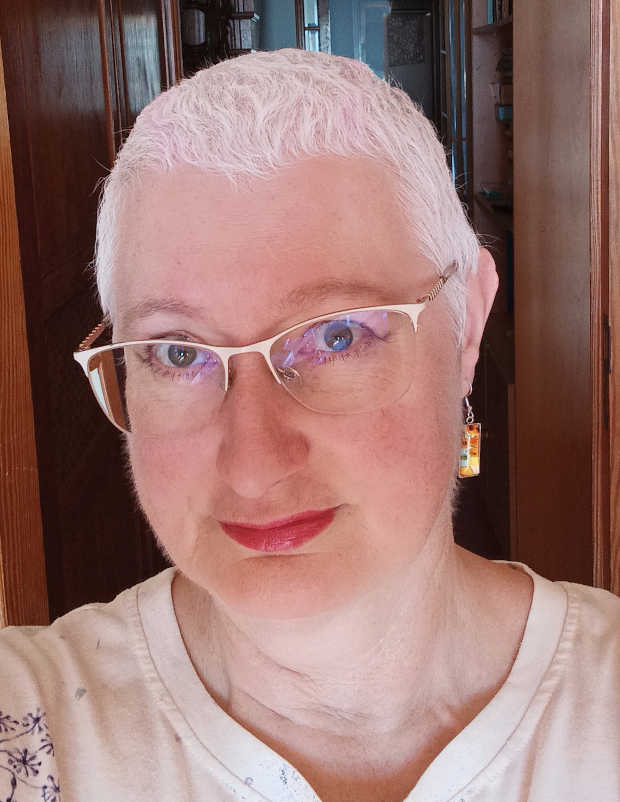 The author with short, white hair after chemotherapy